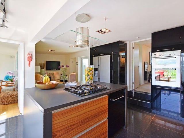 Included within the sale is an integrated double oven, a five ring gas hob, extractor, a new dishwasher, a glass fronted wine fridge and an American style fridge freezer, which is plumbed in.
