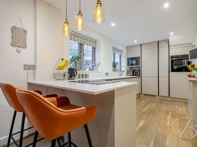 The well-appointed kitchen boasts modern appliances and ample space for dining.