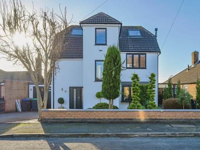 Let's step outside now and return to the striking front of the property, which has fantastic kerb appeal. The small garden, which has plants, shrubs and a tree, is low maintenance, while a driveway has off-street parking space for two vehicles and leads to an integral garage, which boasts a reinforced set of doors and access also from the rear garden and from the kitchen diner.