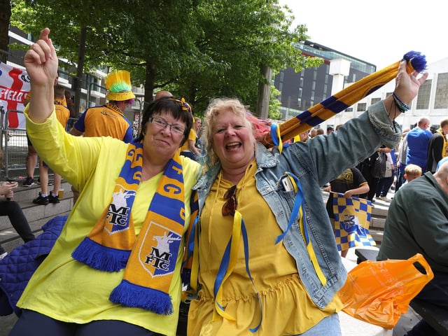 Mansfield Town fans soak up the Wembley atmosphere.