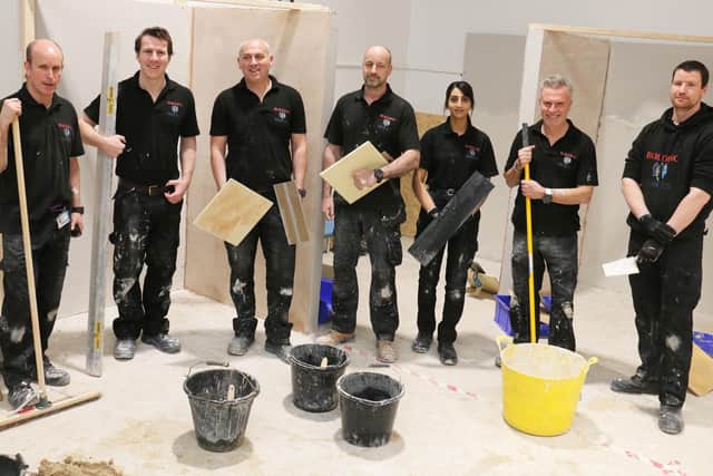 A group of military veterans and service leavers in the construction workshop at West Notts College's centre at Station Park, Kirkby.