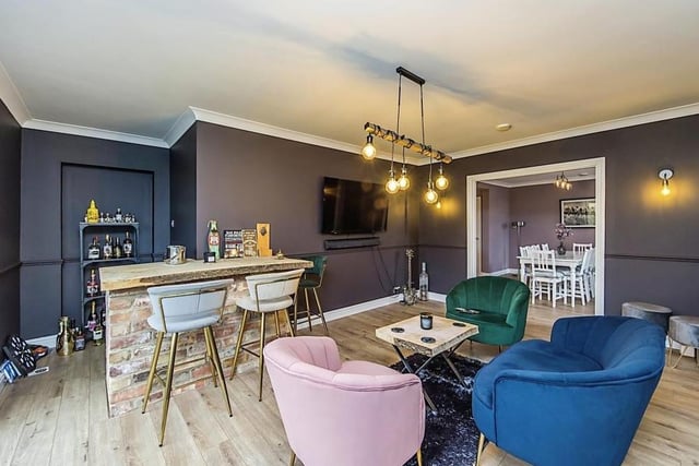 This second reception room has been converted into a bar area, with French doors that lead out to the back garden. Just like being in your local!