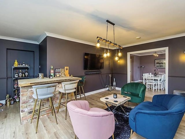 This second reception room has been converted into a bar area, with French doors that lead out to the back garden. Just like being in your local!