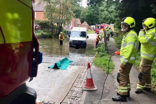 Firefighters rescue stranded van at flooded Rufford Ford.