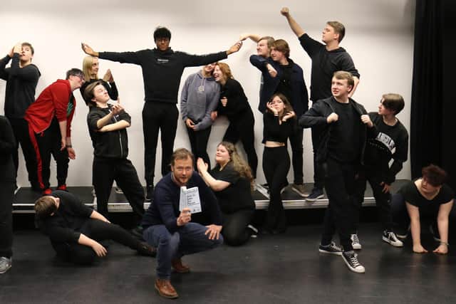 Acting students demonstrate their ensemble work created with performance maker, writer, filmmaker and digital creative Dr Tom Payne (front, centre).