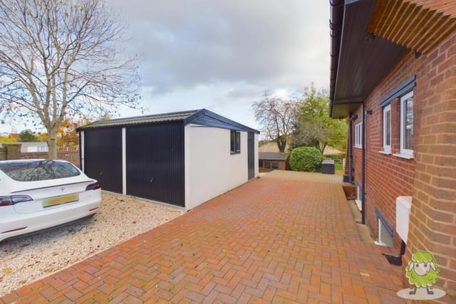 The last photo in our gallery shows a detached double garage at the side of the property.