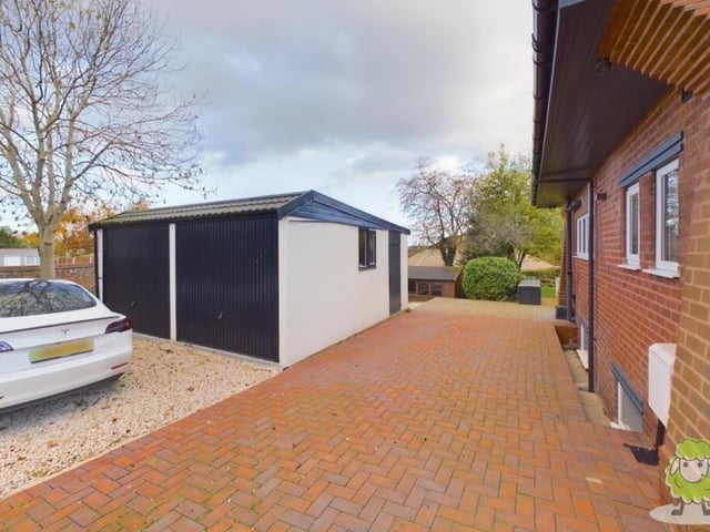 The last photo in our gallery shows a detached double garage at the side of the property.