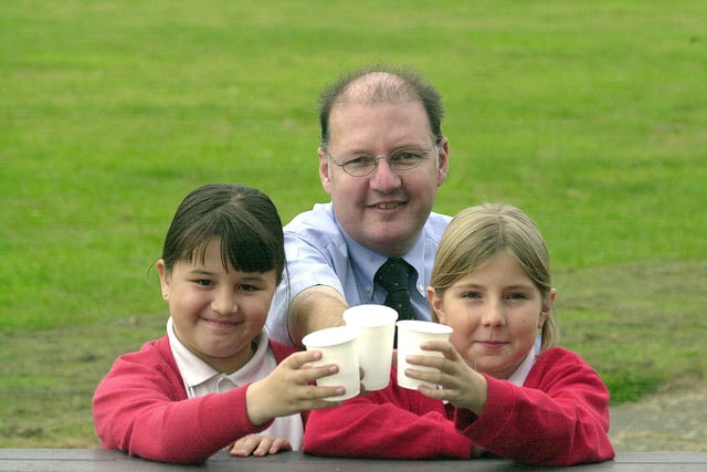 Cheers Head Martin Skinner and pupils Gelicity Wilkins and Hannah Bromage both 9  at the Macmillan coffee morning held in 2002