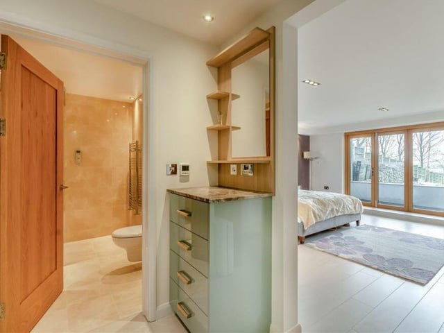 How the master bedroom at The Glass House flows seamlessly into its dressing room and then its en suite wet room.