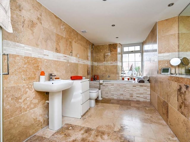 On the first floor you will find this impressive family bathroom. It has a four-piece suite, which comprises a luxury bath with shower over, separate shower, low-flush WC and inset wash hand basin. The floor and walls are fully tiled.