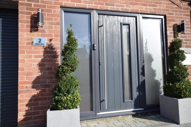 Let's step inside to begin our tour of the Ravenshead house. This stylish front door sits next to the integral garage, which has power and lighting.