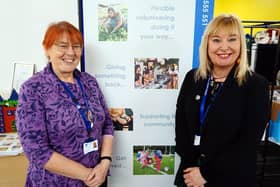 Teresa Jackson (left) hands over the chief executive officer's reins at Ashfield Voluntary Action to Deborah Hill.