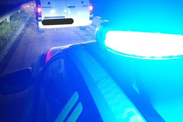 Officers found three people in the van - who were then detained.