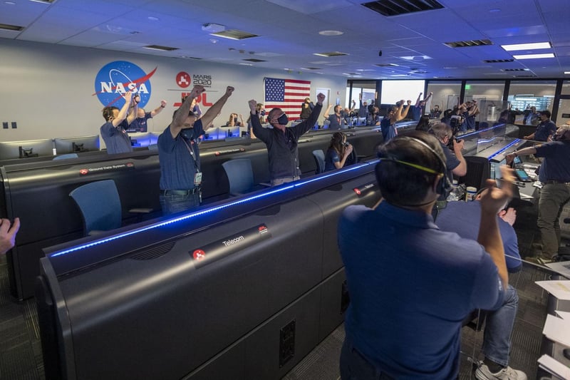 NASA handout photo of scientists cheering the conformation that the Mars Perseverance rover touched down on the red planet. Is