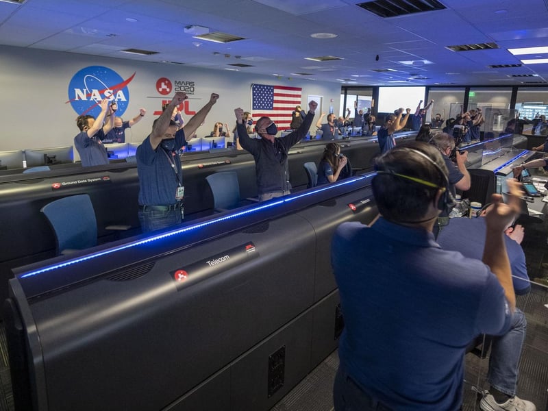 NASA handout photo of scientists cheering the conformation that the Mars Perseverance rover touched down on the red planet. Is