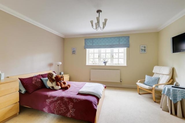 Three of the property's four bedrooms sit on the first floor, starting with this one. It has a carpeted floor, coving to the ceiling and a window overlooking the front of the house.