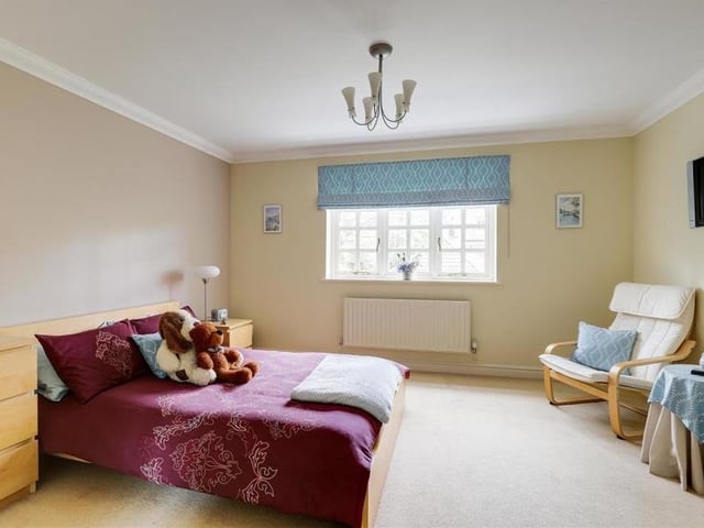 Three of the property's four bedrooms sit on the first floor, starting with this one. It has a carpeted floor, coving to the ceiling and a window overlooking the front of the house.