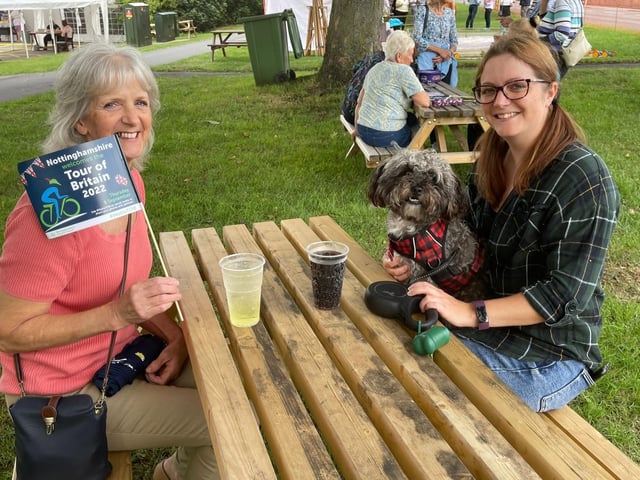 Refreshments being supped as people wait for the riders.
