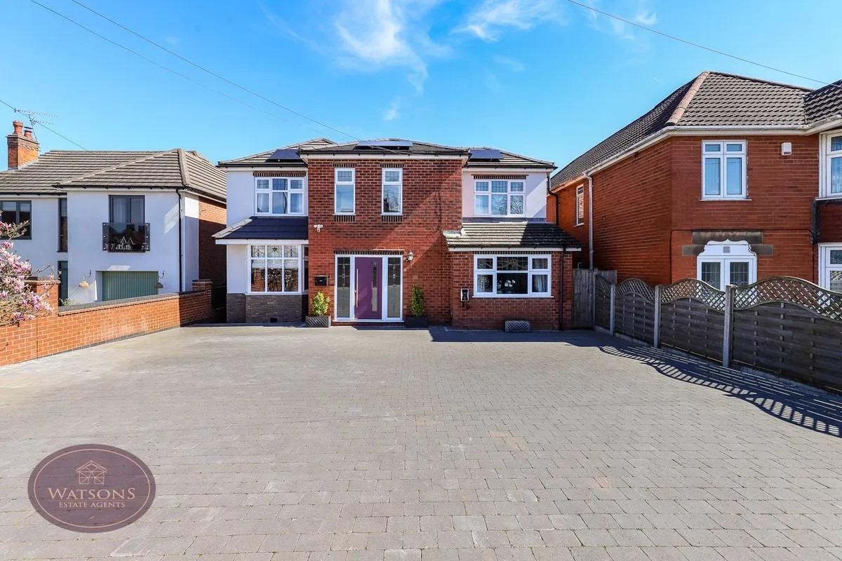 To the front of the property is a double wrought iron gate and a large paved driveway, giving access to the entrance door, enclosed by brick walls.