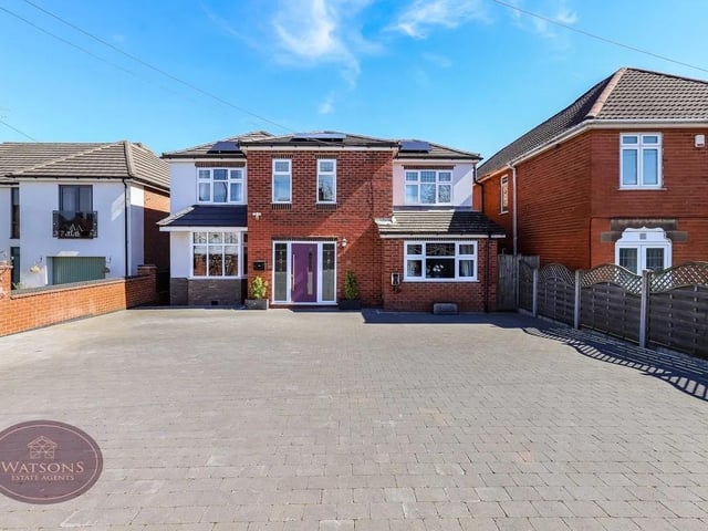 To the front of the property is a double wrought iron gate and a large paved driveway, giving access to the entrance door, enclosed by brick walls.