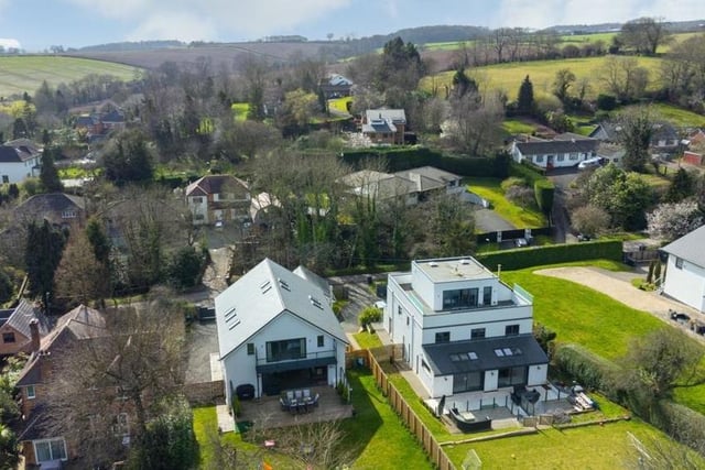 This aerial view shows how the £1.25 million property stands proud on Lambley Lane in the popular village.