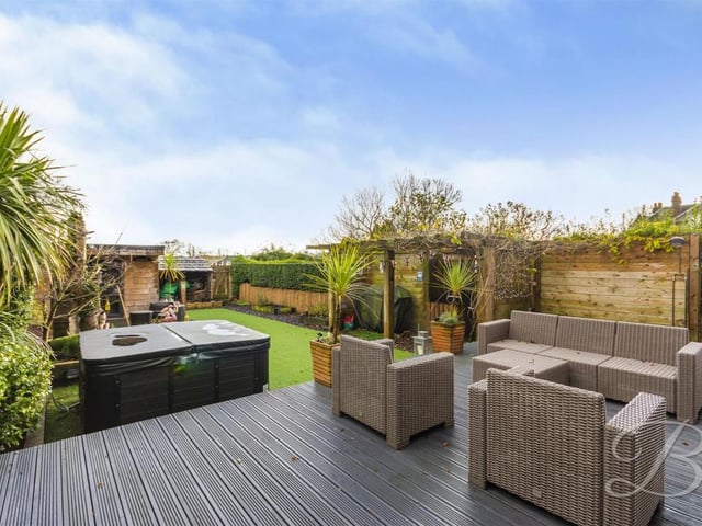 The garden has a hot tub, BBQ area and summer house.