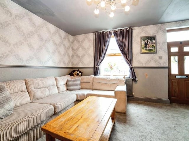 The font door of the Alexandra Street property leads straight into the comfortable lounge or living room.