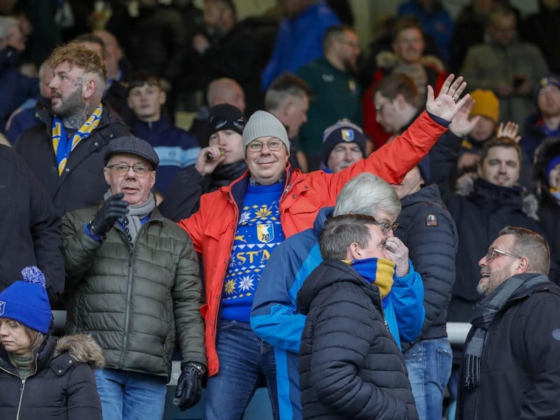 Mansfield Town fans watch the brilliant win at Peterborough United.