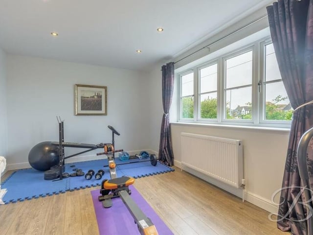 This bedroom has been turned into a well-equipped home gym.