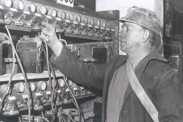 Bill Frost puts his lamp on charge after finishing his shift at Mansfield Colliery..Jan 23rd 1963