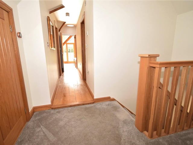Time to climb the stairs to the first floor at Moles End now. This landing, which contains useful storage cupboards and a Velux window, leads to the other three bedrooms and the family bathroom.