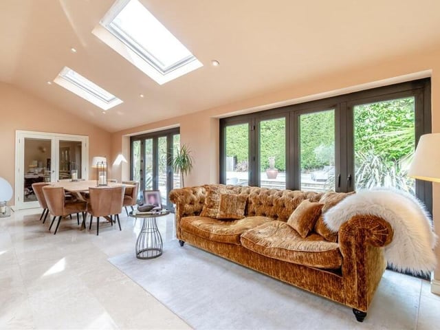 Next to the dining area in the open-plan kitchen/diner is this living space, with underfloor heating. Velux roof windows add to the natural brightness