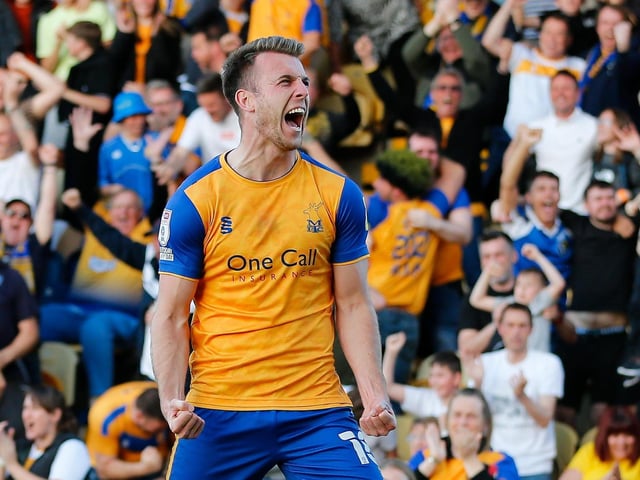 Mansfield Town forward Rhys Oates enjoys his first half goal in the semi-final first leg against Northampton Town.