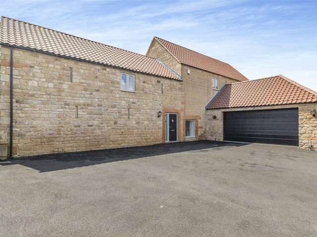 At the front of the property, a good-sized tarmac driveway has off-street parking space for up to five cars and leads to a large double garage with remote-controlled, electric up-and-over doors. The garage is equipped with power and light and hosts a wall-mounted Baxi central-heating boiler and pressurised hot-water cylinder.
