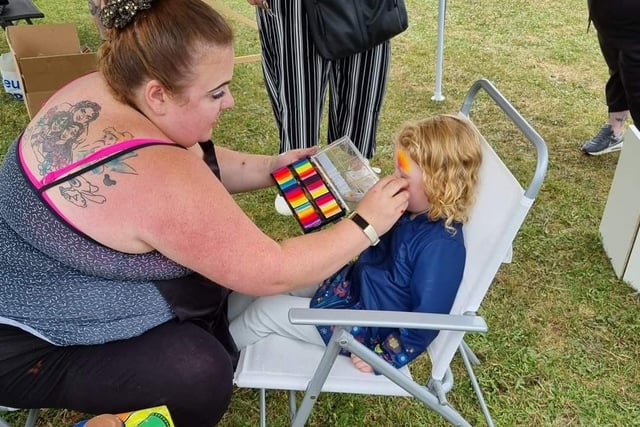 Face painting was popular for many visitors.