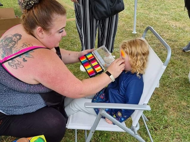 Face painting was popular for many visitors.