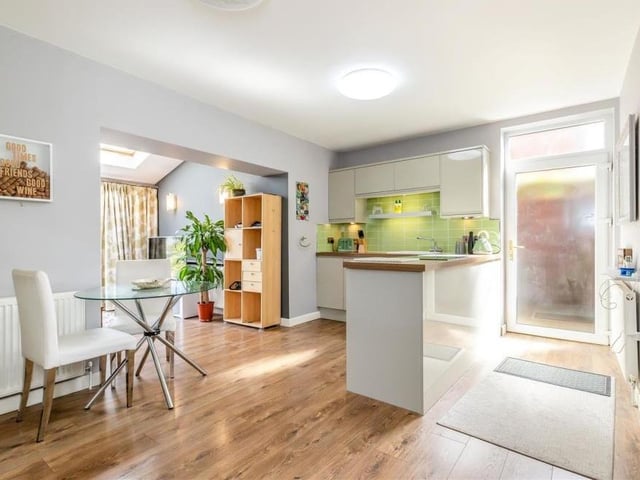 Into the annexe now and a look at its kitchen/diner, which as an integrated double oven and a four-ring induction hob, plus an integrated dishwasher and fidge/freezer.