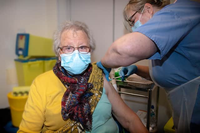 Ann Allen, aged 81, is the first Sherwood Forest Hospitals patient to  receive the Covid-19 vaccine in the North Nottinghamshire area. Giving the jab is nurse Liz Gethings.