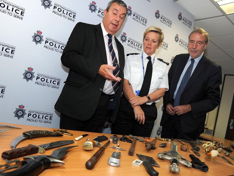 Police and Crime Commissioner Paddy Tipping, right, with Coun. David Ellis and Assistant Chief Constable Kate Meynell look over the handed in assortment of potential weapons following a recent knife amnesty.