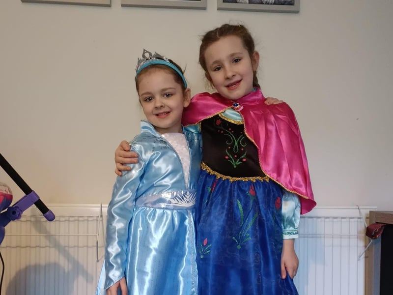 Anna & Elsa, ages eight and six.