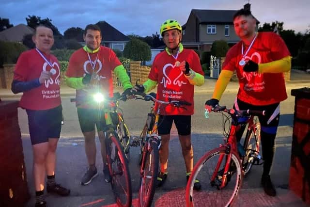 From left: Andrew, Christopher, Peter and Philip with their medals at the end of the ride.