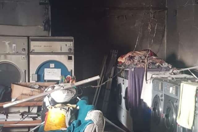 Fire damage to the New Cross launderette following the blaze.