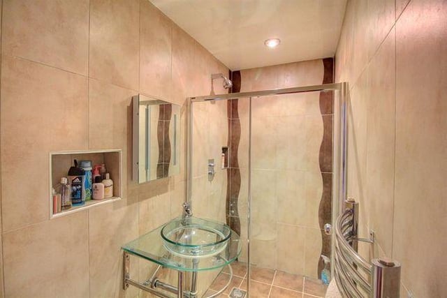 A well presented shower room is located on the first floor and includes a shower cubicle, WC and sink unit.