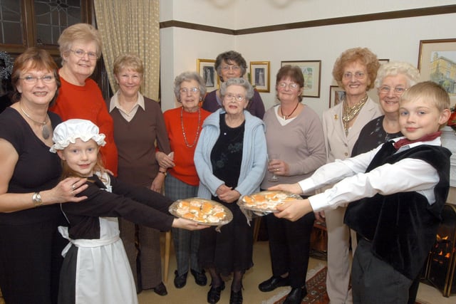 Members of the local committee of Macmillan Cancer Support were served in style at their annual Christmas Evening in 2006