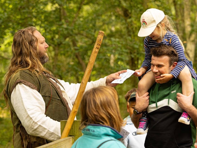Little John is tracked down by visitors playing Hunt the Outlaw at Sherwood Forest on Sunday, July 30.