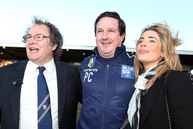 John Radford celebrates with Paul Cox (C) and wife Caroline Radford after Mansfield beat Wrexham to win the Blue Square Bet Premier title and seal the club's return to the Football League.