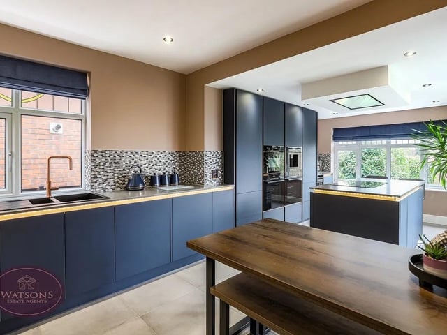The kitchen boasts ample space to cook and dine.