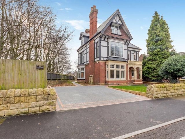 The front garden is mainly laid to lawn, next to a block-paved driveway that provides off-street parking space for two cars.