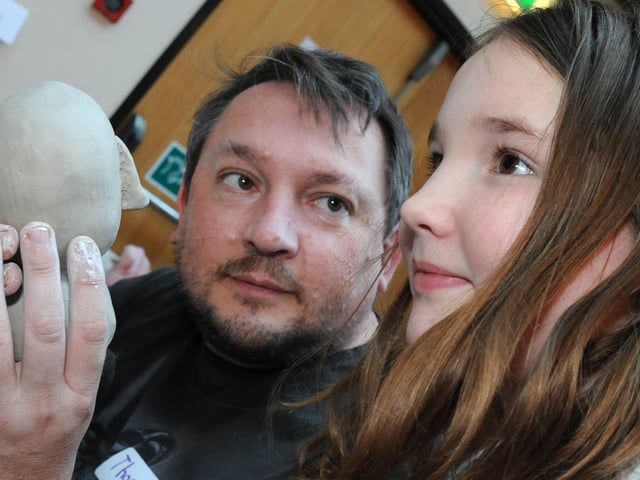 Mud heads challenge Mansfield Museum.         Steve Loates checks out the profile of daughter Elissa before modelling her facial features as part of the Mud Head challenge at the Museum in 2017.