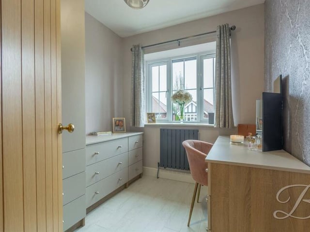 The smallest of the three bedrooms on the first floor could be used as a dressing area or even a home office. It has laminate flooring.